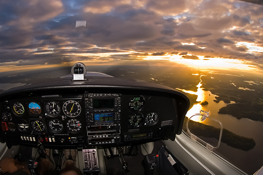 General aviation cockpit in flight at golden hour